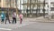 School children cross the road in medical masks. Children go to school