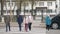 School children cross the road in medical masks. Children go to school