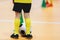 School children playing indoor soccer at physical education class