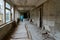 School corridor, dead abandoned ghost town Pripyat in exclusion zone of Chernobyl NPP, Ukraine