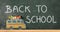 School creativity with bus drawn on blackboard back to school