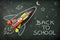 School creativity with rocket drawing on blackboard back to school