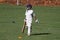 School cricket boy bat in hand