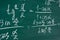 School, education, lesson. Mathematics formulas written on the chalboard.