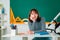 School and education. Teenager girl near chalkboard in school classroom. Individual tutoring.