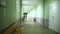 School empty corridor interior green wall to right