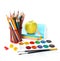 School equipment with pencils, paints , brushes and apple