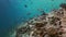 School flock of colorful fish in sea soup on reef.