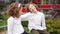 School friendship. A pair of teenagers, a boy and a girl are sitting on the railing, the girl is holding her hand on the