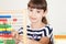 School Girl With Colourful Books And Abacus