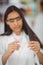 School girl experimenting with piece of glass in laboratory