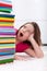 School girl shocked by the large stack of books