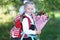 School girl in a uniform with bouquet of autumn flowers. Back to school