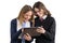 School girlfriends look at the tablet. Teenage girls in school uniform on white background, picture is isolated