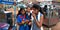 School girls having street food