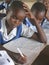 School girls writing in class