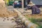 School janitor builds a brick pathway