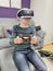 School kid boy experiencing virtual reality video game. Surprised little boy looking in VR glasses. Digital activity for