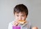 School kid eating  honey on toasted for breakfast before go to school, Portrait Healthy child boy eating butter on bread in the