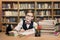 School Kid Studying in Library, Child Writing Book, Shelves