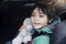 School kid taking his teddy bear traveling with him for explorer on his vocation, Child boy sitting in car seat with belt on