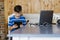 School kid using laptop while doing schoolwork at home. Homeschooling. School from home