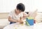 School kid using plastic block counting number,Child boy studying math by colour stack box,Montessori classroom material for