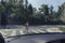 School kids on the pedestrian crossing, view from inside the car