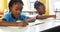 School kids studying in classroom