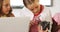 School kids using magnifying glass over rock