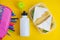 School lunch sandwich and green apple, bottle of water, healthy eating concept, colorfu encils yellow background, top view with co