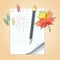 School notepad with pencil and autumn leaf