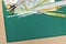 School and office supplies on green cutting mat board background