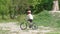 School participant rides a mountain bike on a sandy hill