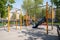 school playground with monkey bars, climbing ropes, and swings for adventurous kids