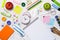 School stationery or office supplies on wood background.