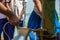 School students collecting fresh water from the tube well. World water day concept. Child holding the traditional steal mug