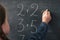 School studying mathematics girl do sum chalkboard
