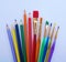 School stuff for art education, wooden color pencil and paint brushes in several colors