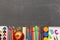 School supplies on black chalkboard background. Back to school. Banner. Concepts of study and education. copy space. Top view