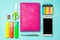 School supplies on a bright blue background, top view, concept of education, desktop, creative school desk