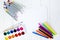 School supplies for drawing on the table: paper, pencils, paints, markers
