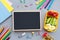 School supplies and lunch box with sandwich and vegetables. Back to school. Healthy eating habits concept - background layout with