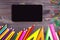 School supplies pencil, pen, ruler, triangle on blackboard bac