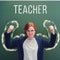 School teacher with chalked strong arms. Woman teacher shows the muscles of the drawn hands