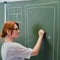 A school teacher is knocking on a chalk painted door. Concept welcome back to school