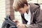 School teen with electronic tablet sitting