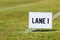 School track and field Lane 1 sign on grass