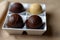 School truffles in melted milk, dark and white chocolate. World Chocolate Day