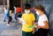 School tweens in medical masks in schoolyard during break